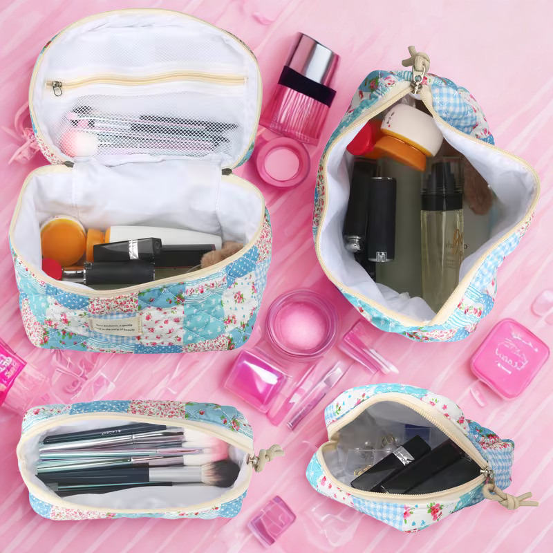 All four country quilt cosmetic bags displayed together on tiled bathroom steps