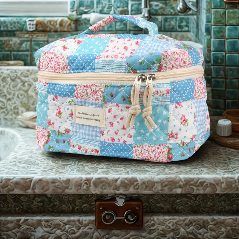 Country quilt large train case on vintage bathroom vanity