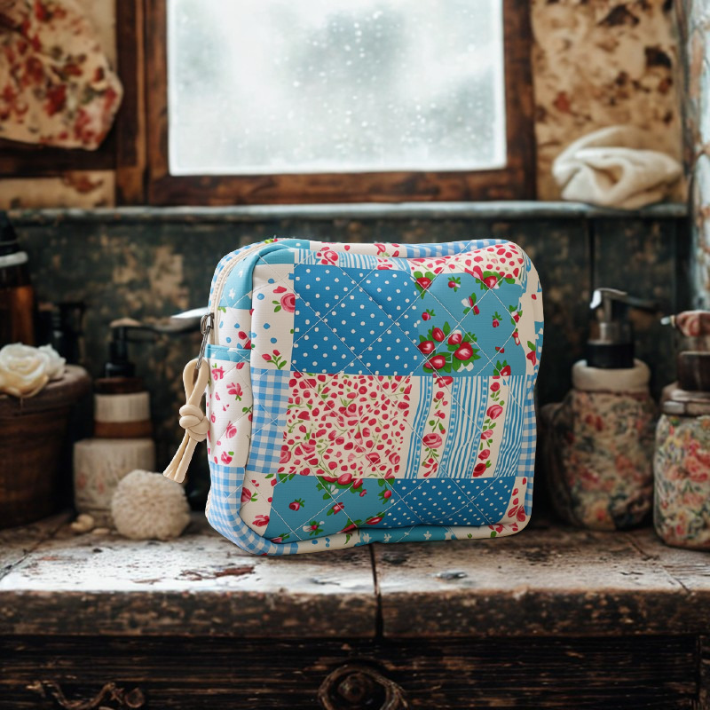 Large country quilt cosmetic bag on floral vanity bench
