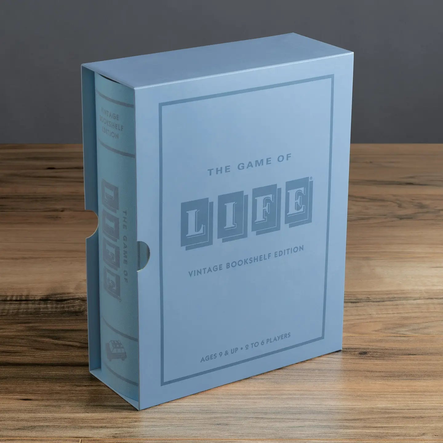 The Game of Life Vintage Bookshelf Edition - book box on antique library shelf