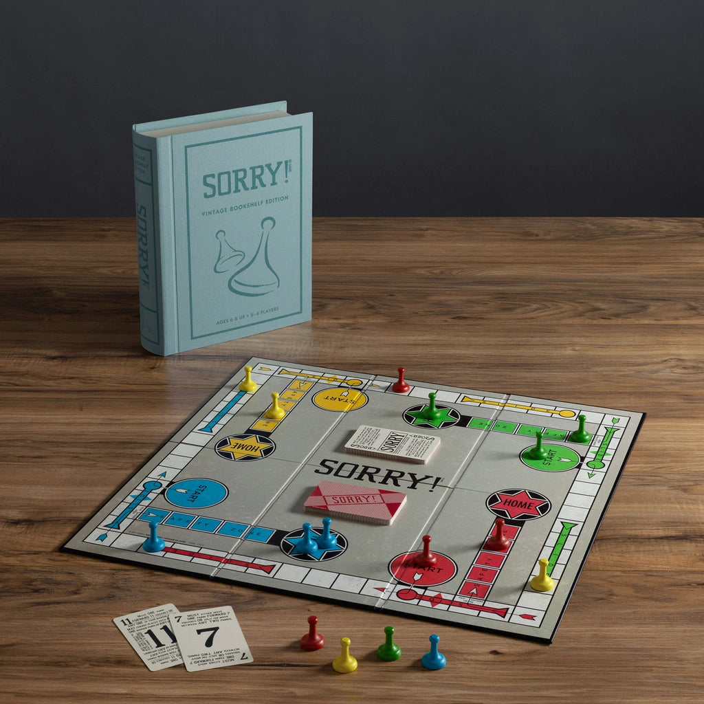 Sorry! Vintage Bookshelf Edition game board and book on white background
