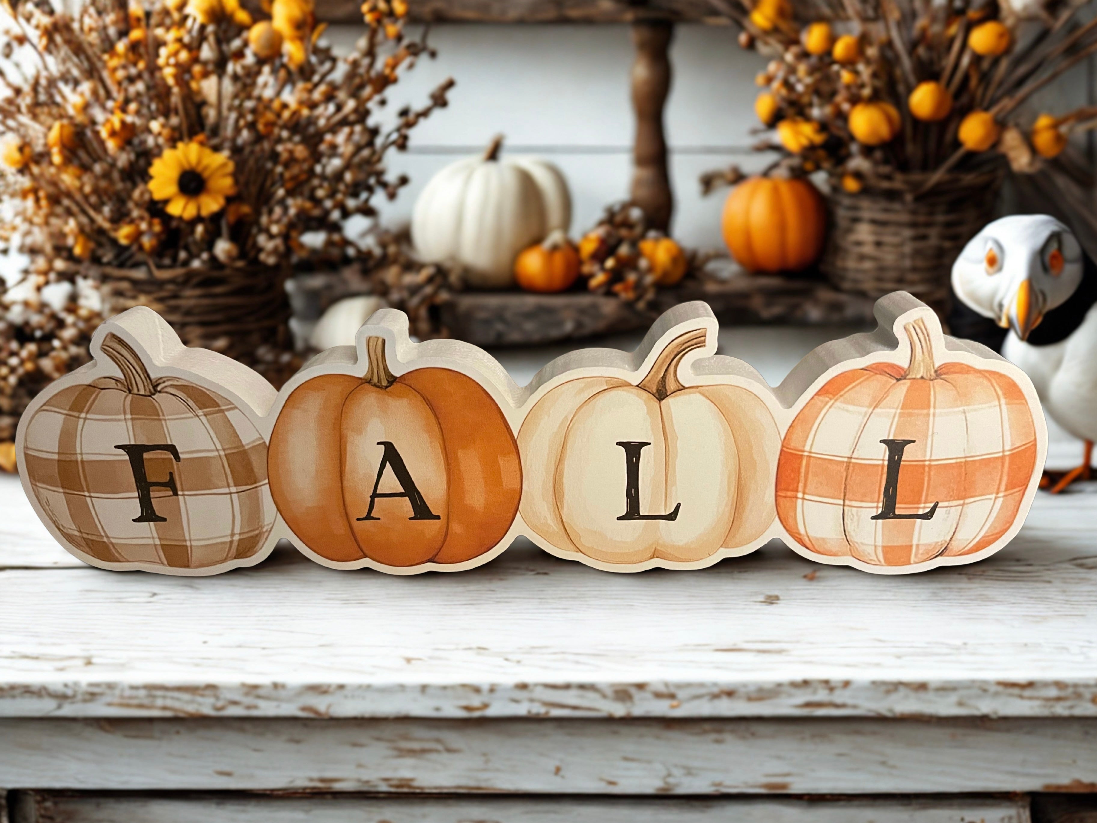 Fall patchwork pumpkins wooden sitter on white bench with fall florals