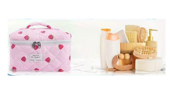 Large strawberry quilted train case makeup bag shown with toiletries