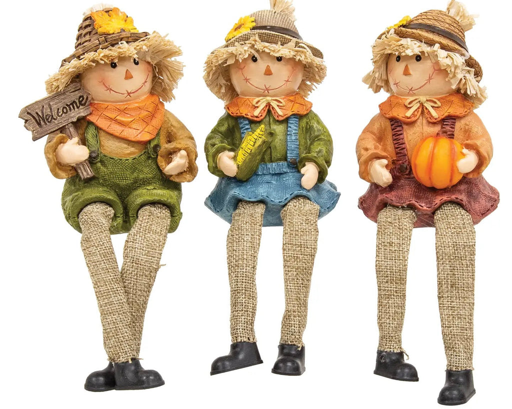 Raggedy scarecrow shelf sitter lifestyle shot with fall arrangement