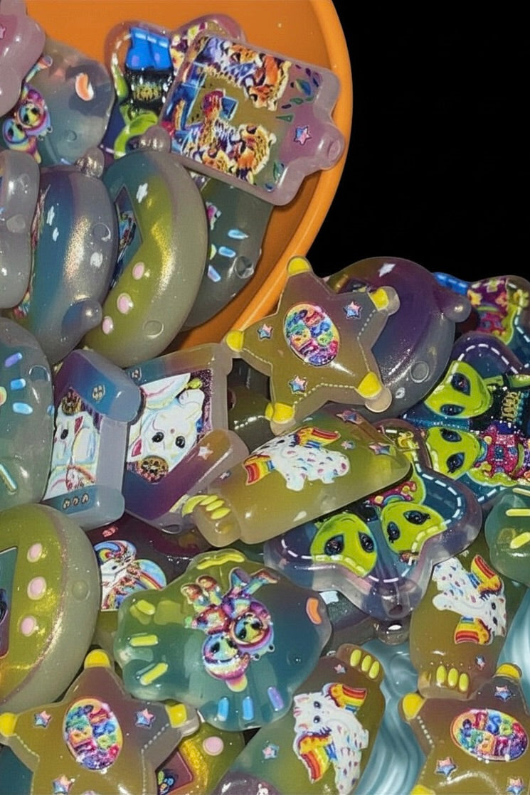 Rainbow jelly fantasy bead charms in orange bowl