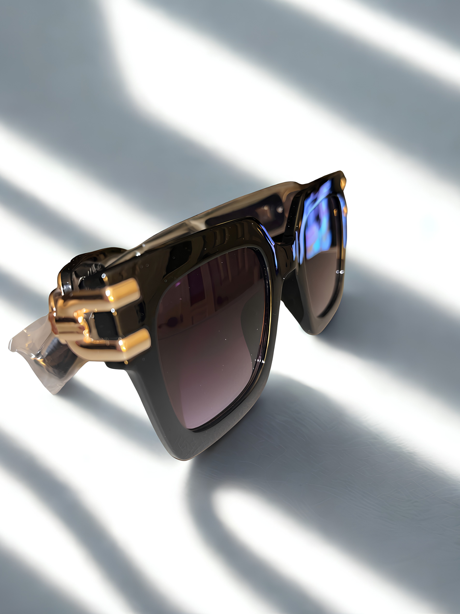 Black Ice Sunglasses on marble surface in natural light