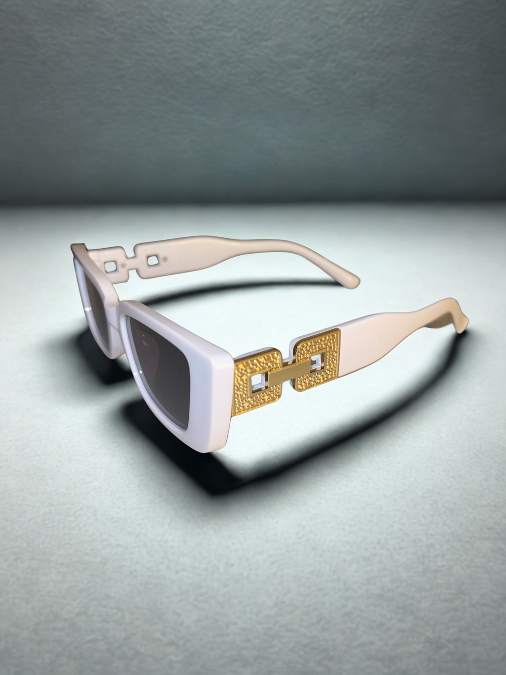 The Prestige Frames white held up showing gold hardware detail