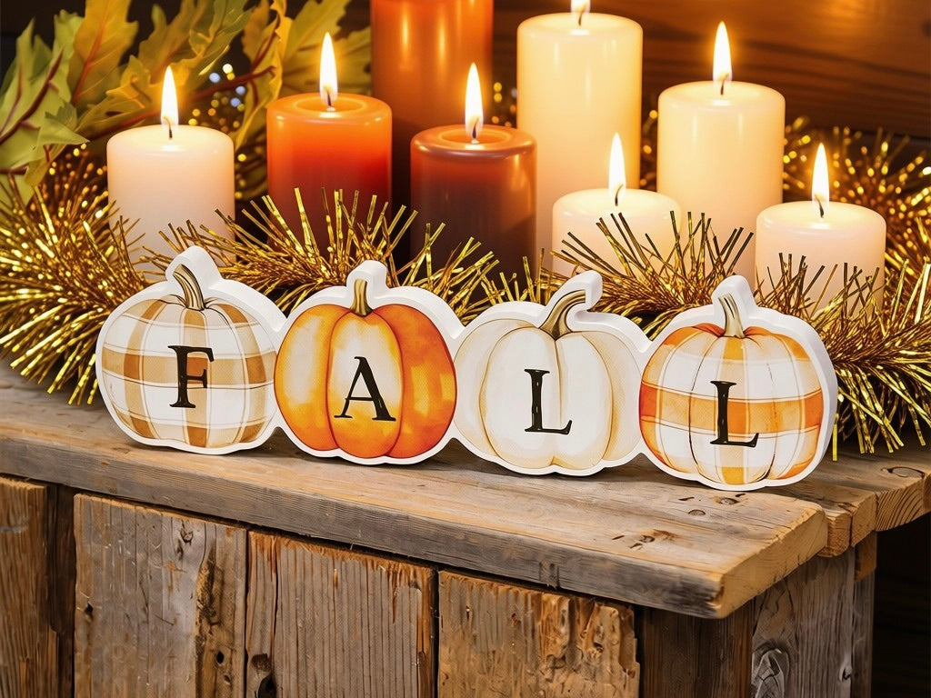 Fall patchwork pumpkins wooden sitter styled with colorful candles and gold garland