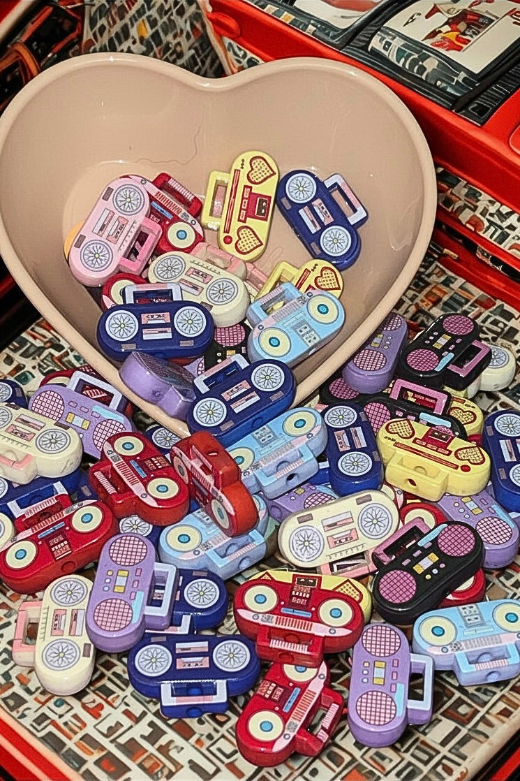 Retro boombox beads in a cream heart bowl on patterned background
