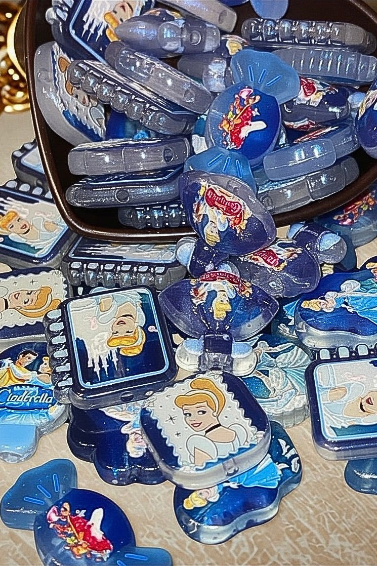 Cinderella character beads scattered showing various shapes and scenes