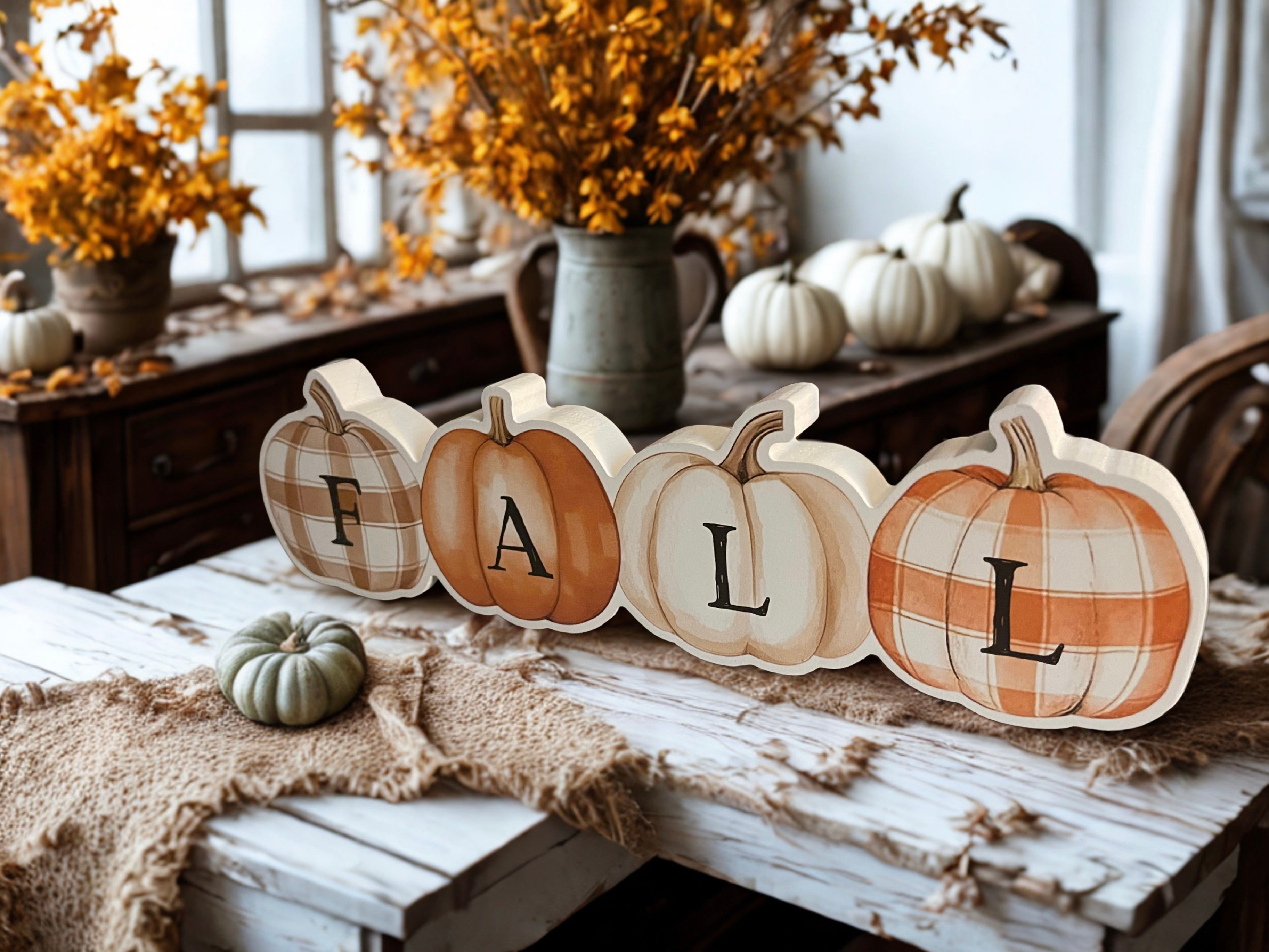 Fall patchwork pumpkins wooden sitter styled on rustic table with white pumpkins
