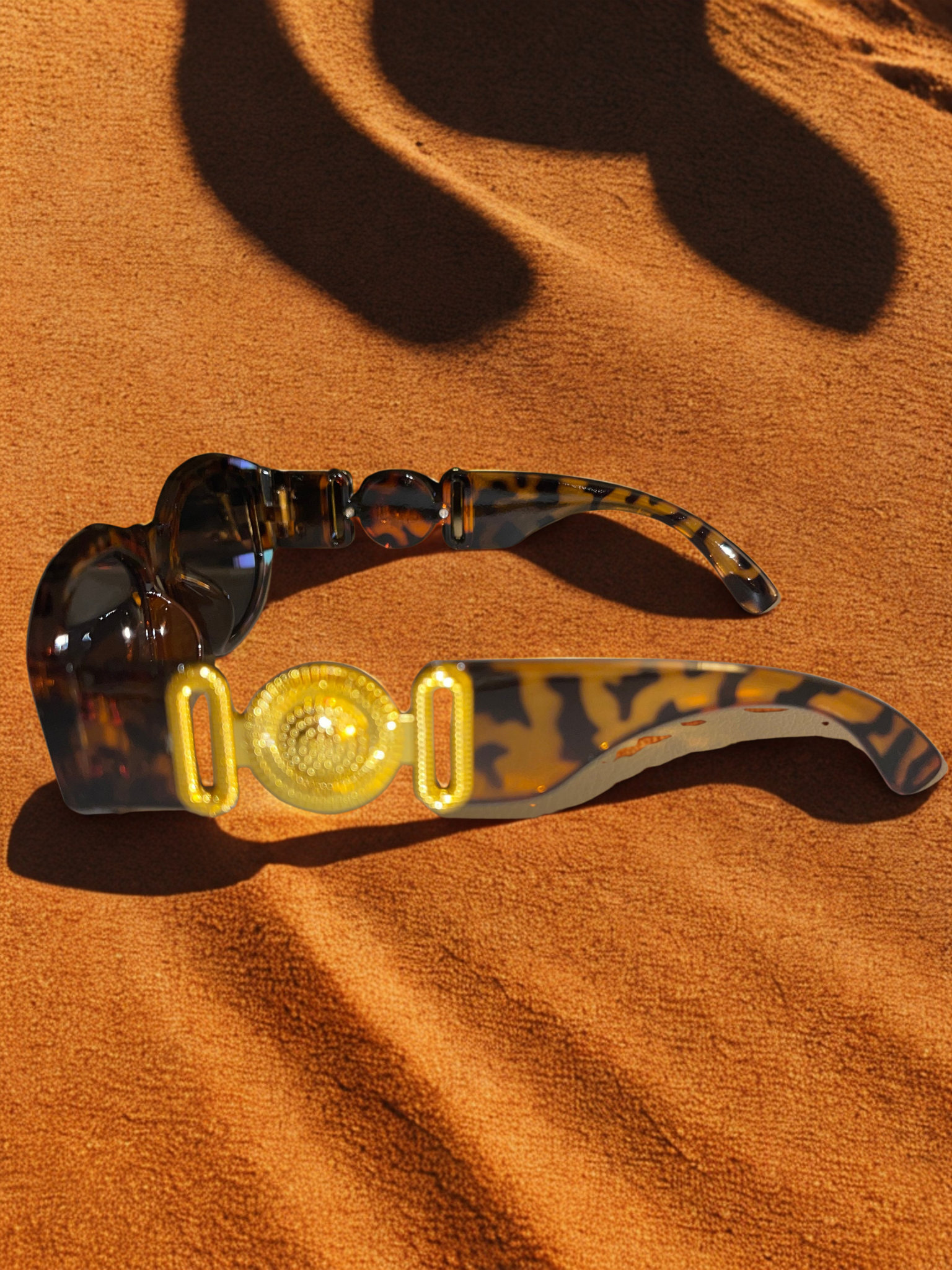 The Versailles Frames black on marble showing gold medallion detail