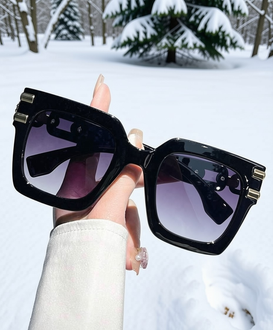 Black Ice Sunglasses close up detail of gold chain hardware temple