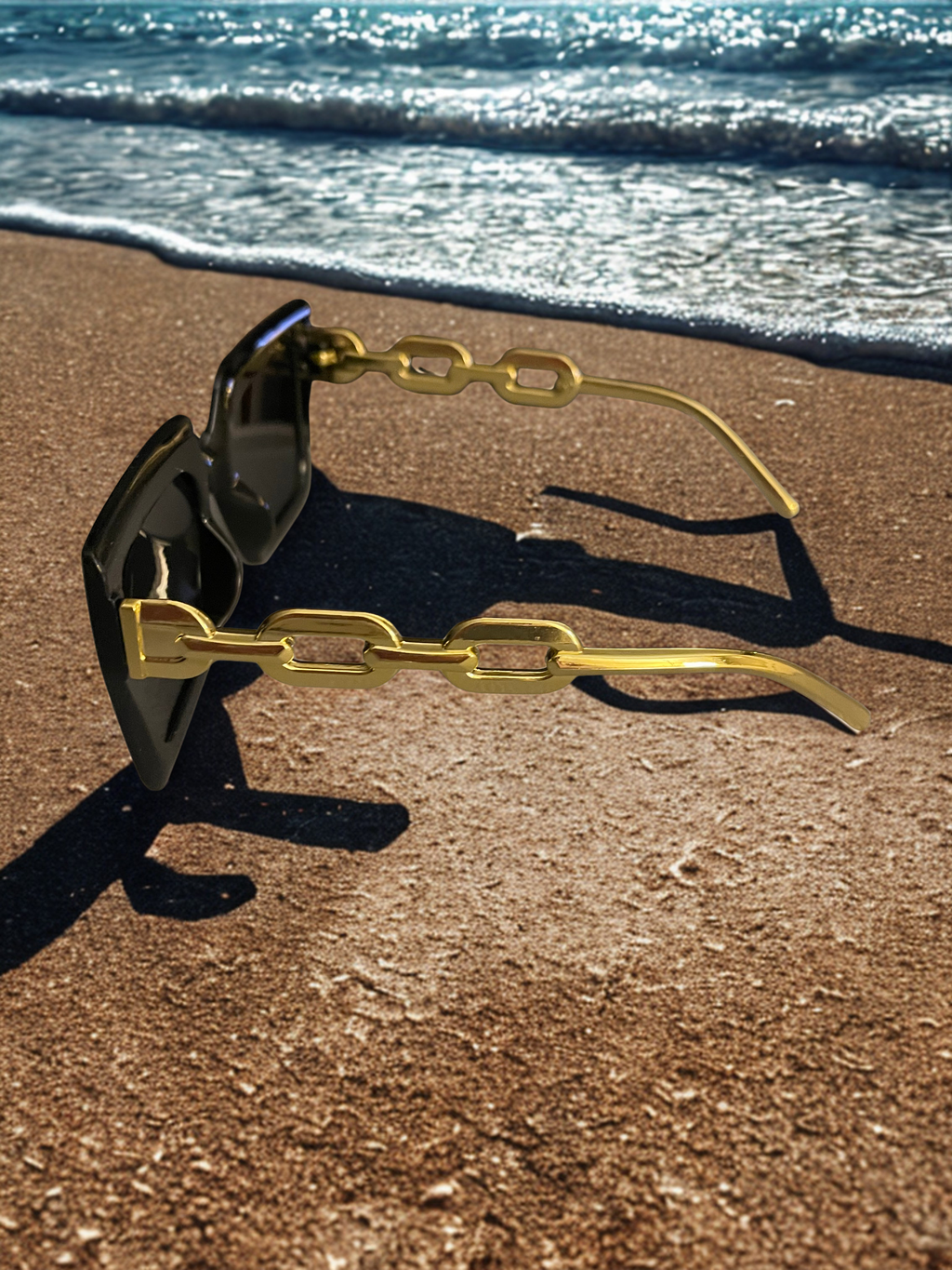 Chain Reaction Sunglasses on sand at beach