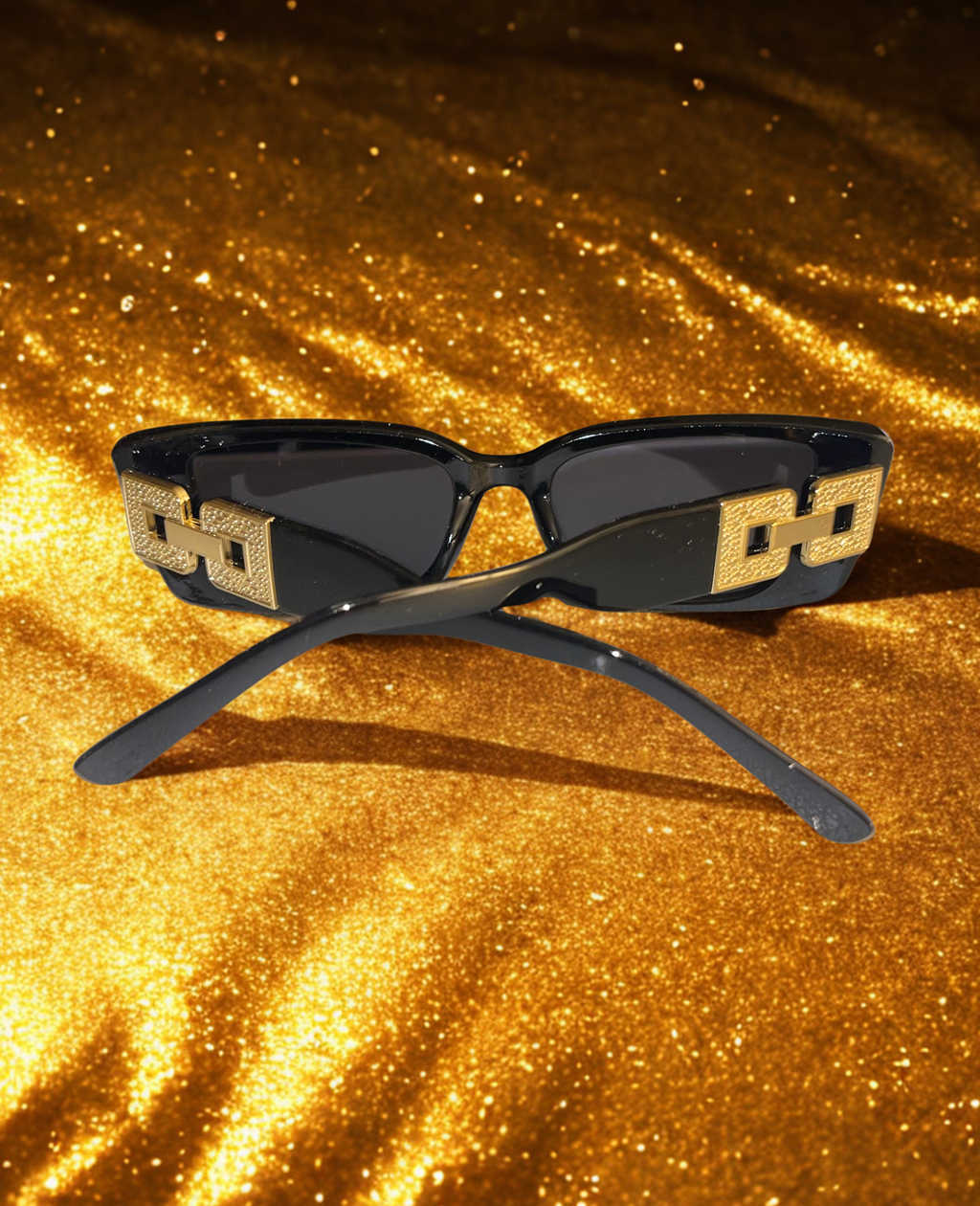 The Prestige Frames black detail shot of gold hardware temple