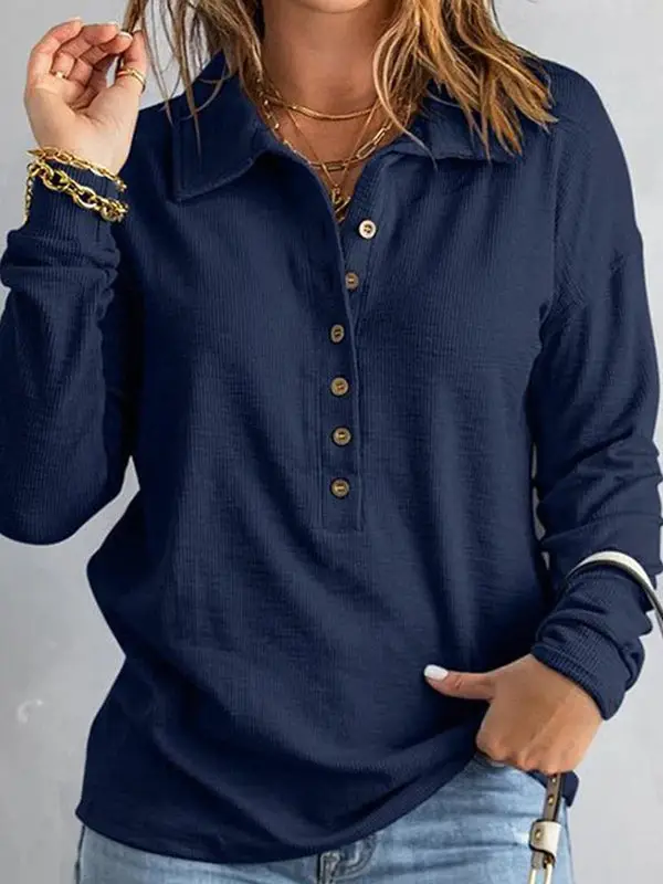 Loose lapel buttoned top worn - navy blue lifestyle front detail